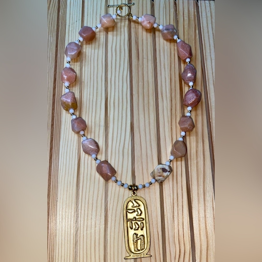 Hand Crafted peach moonstone beaded necklace w/ vintage gold cartouche pendant.